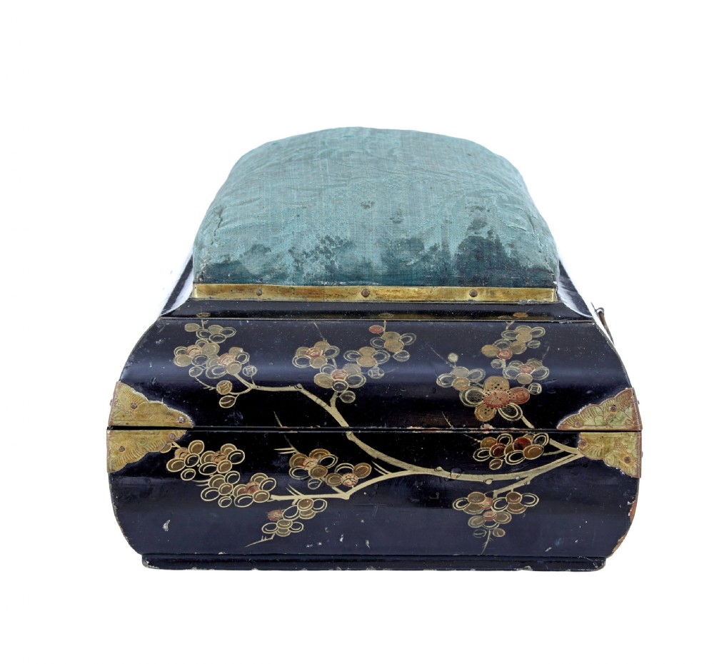 A 19th-century black lacquered jewellery box decorated with gilded botanical motifs, an ornate brass clasp, and a pale blue padded silk top. View XI