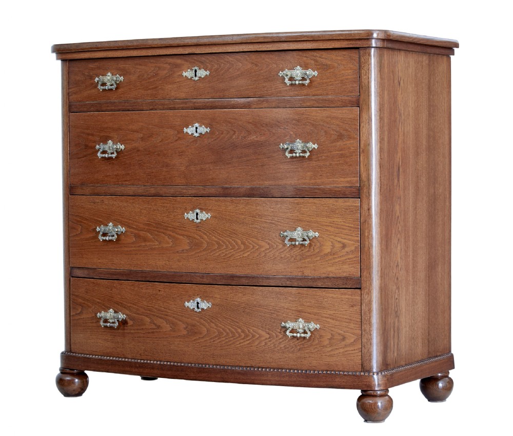 19TH CENTURY BOWFRONT OAK CHEST OF DRAWERS