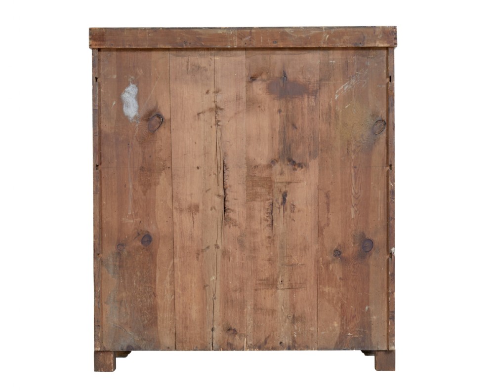A 19th-century Swedish pine cupboard featuring two panelled doors with faux-wood grain paintwork and a low shaped splashback. View IV