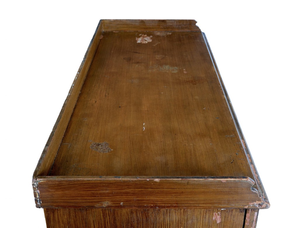 A 19th-century Swedish pine cupboard featuring two panelled doors with faux-wood grain paintwork and a low shaped splashback. View IX