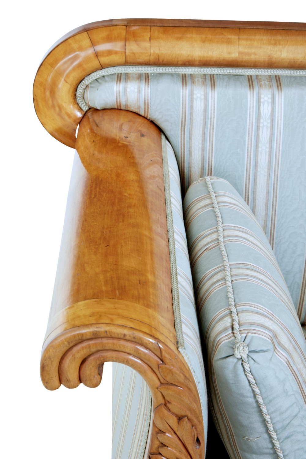 A 19th-century Swedish carved birch sofa featuring scrolled arms, floral rosettes, swept feet, and light blue and white striped upholstery. View VI