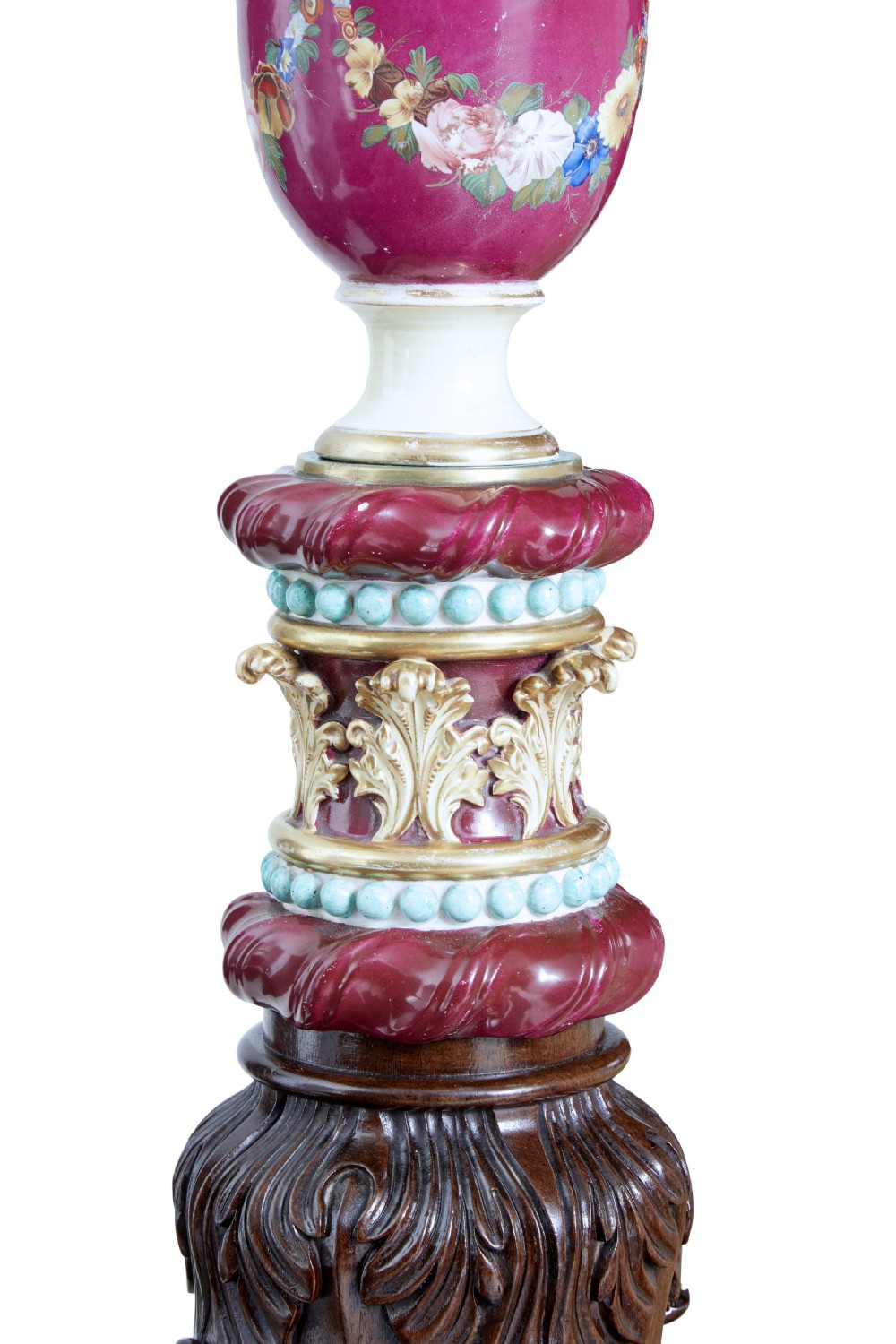 A nineteenth-century mahogany four-poster bed frame featuring carved posts with pink porcelain sections, marquetry panelling, and an ornate trefoil canopy trim. View XI