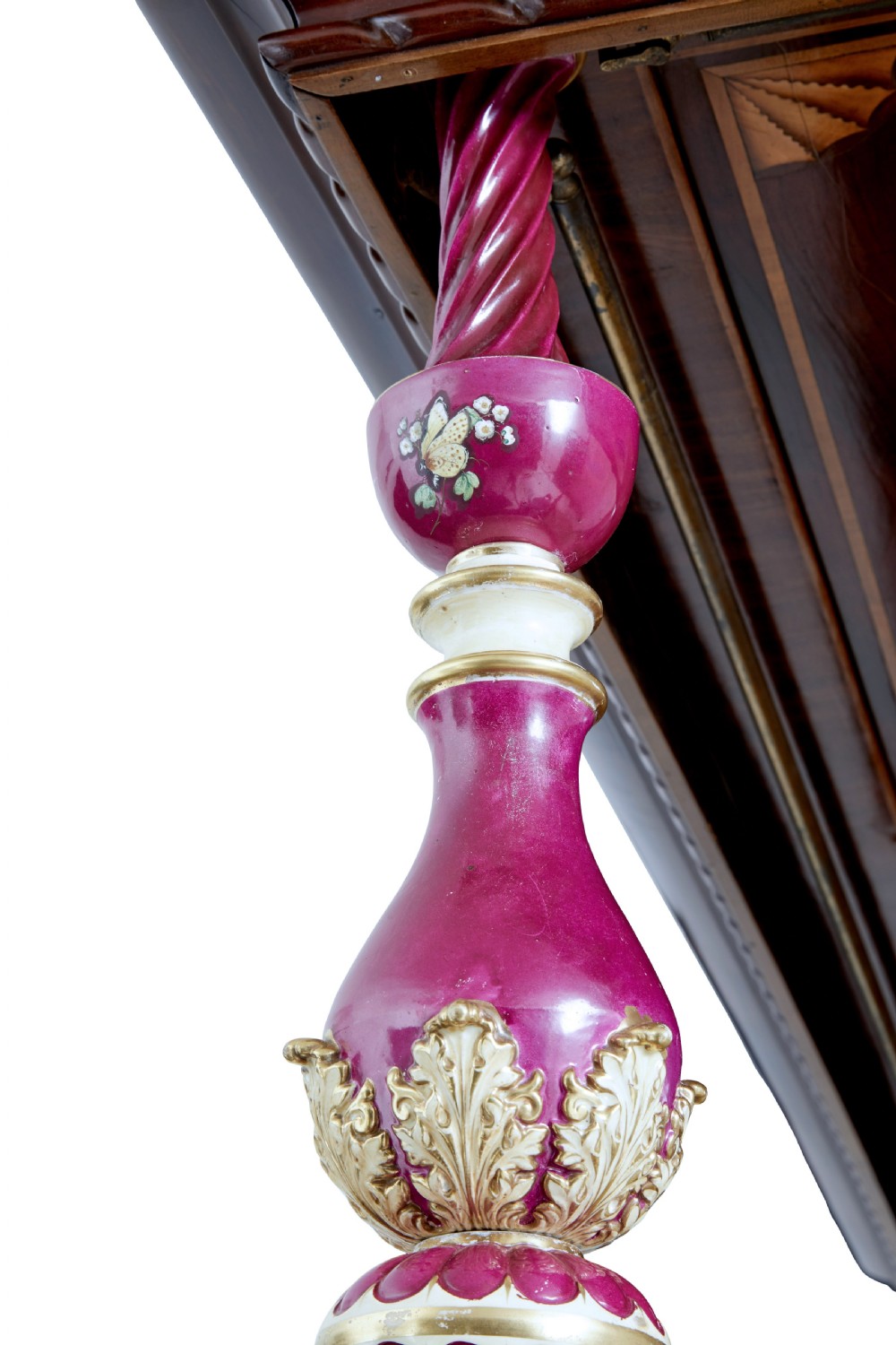 A nineteenth-century mahogany four-poster bed frame featuring carved posts with pink porcelain sections, marquetry panelling, and an ornate trefoil canopy trim. View XIV