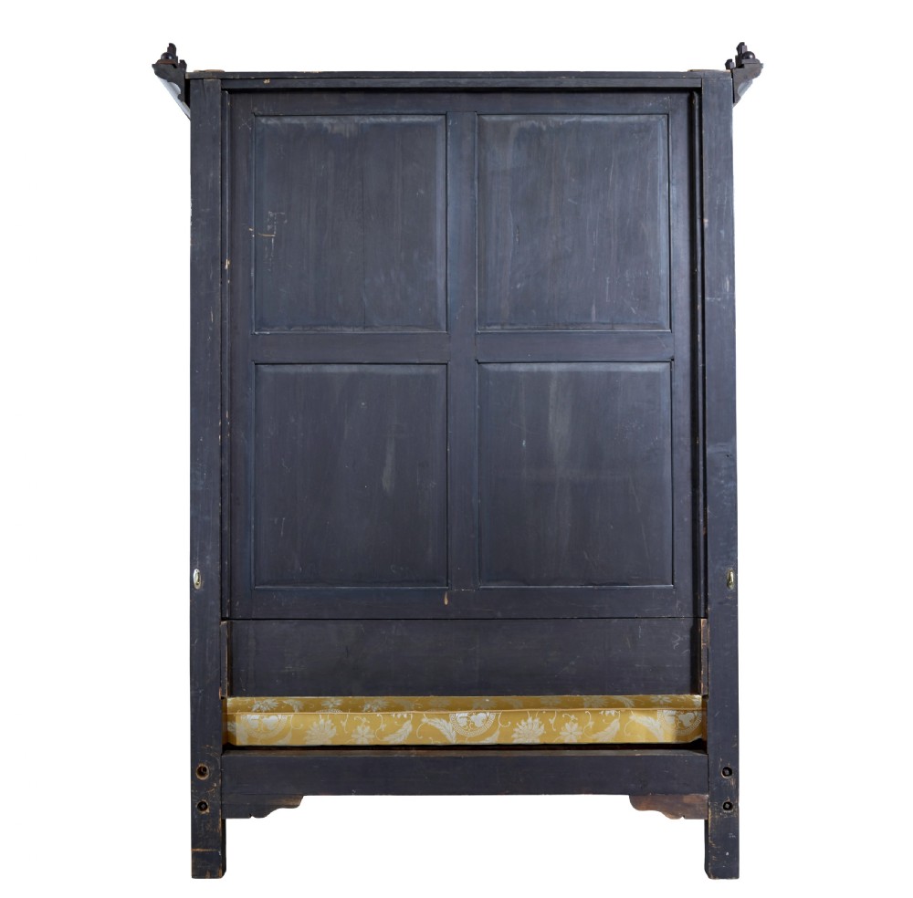 A nineteenth-century mahogany four-poster bed frame featuring carved posts with pink porcelain sections, marquetry panelling, and an ornate trefoil canopy trim. View XVIII