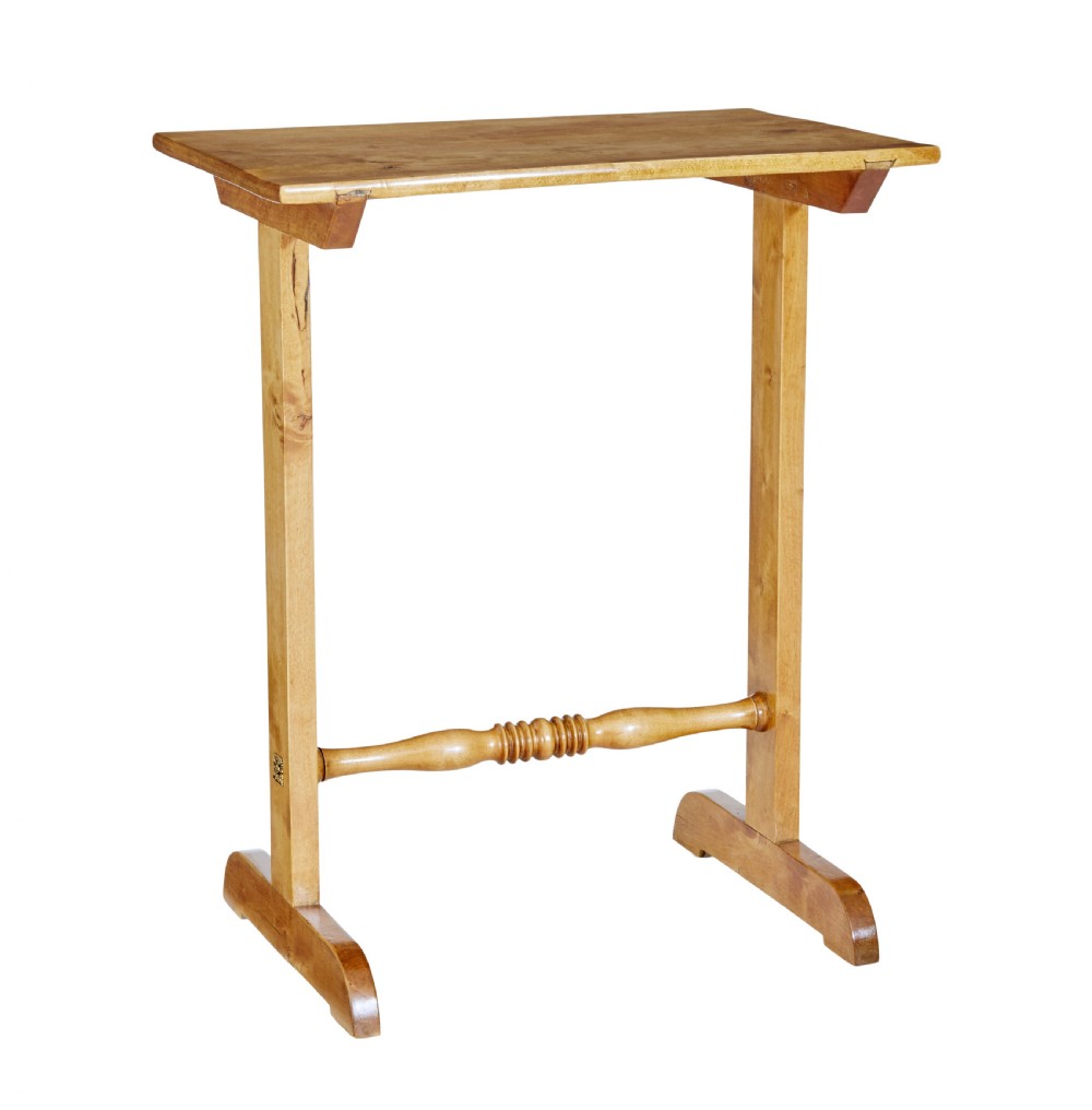 A tall Swedish early 20th-century birch side table featuring a rectangular top, two upright supports, and a central turned cross-stretcher.