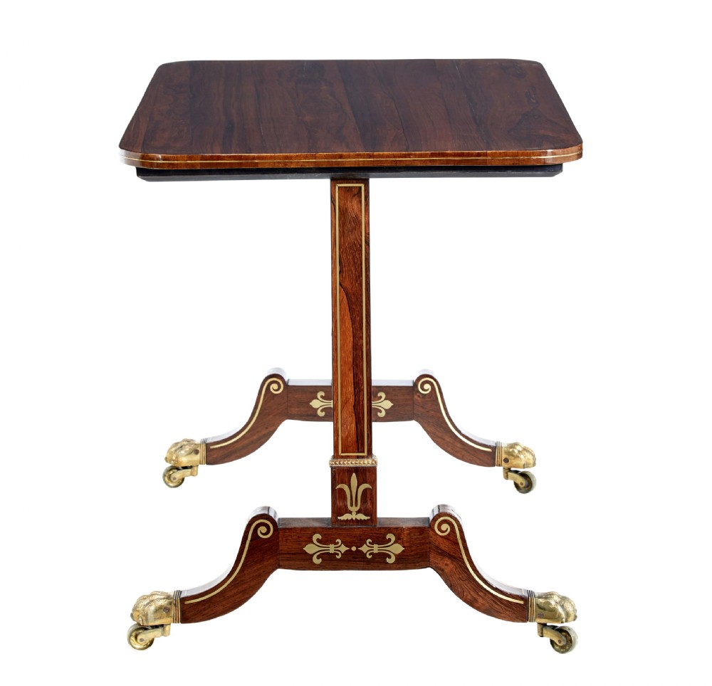 An early 19th-century Regency dark wood side table with delicate brass inlay, trestle base, and brass claw feet on castors. View III