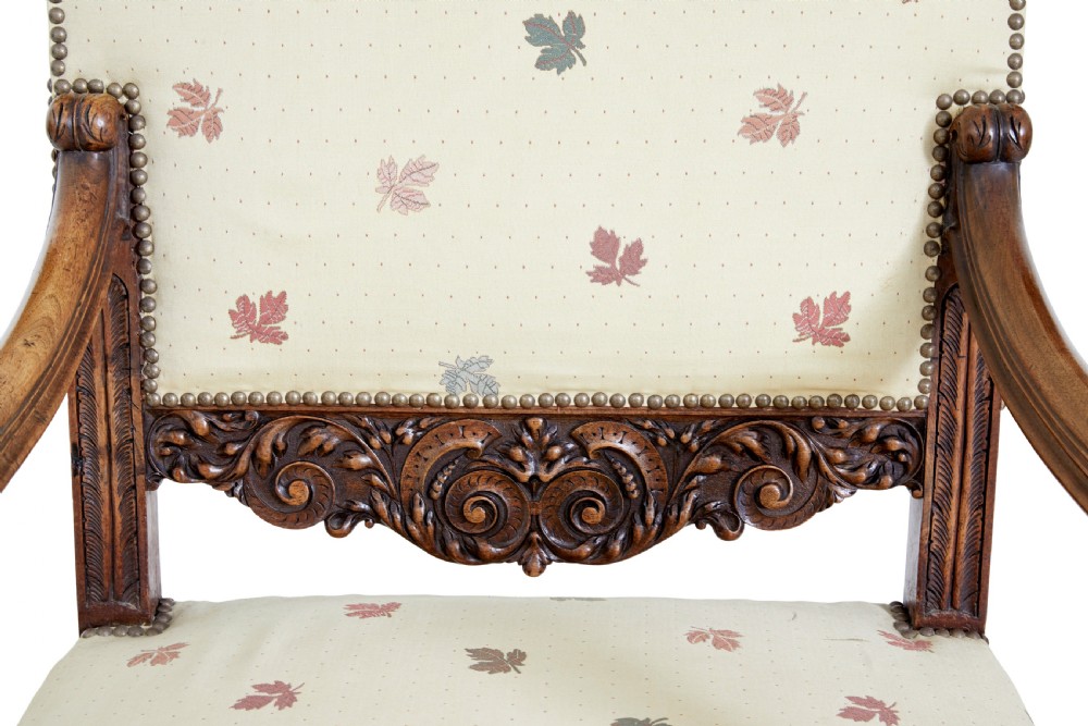 Pair of 19th-century French carved walnut armchairs with high rectangular backs, scroll arms, and cream leaf-patterned upholstery. View III