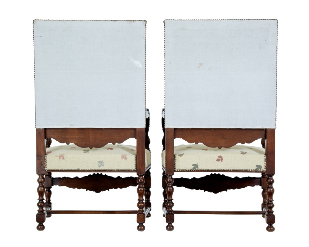 Pair of 19th-century French carved walnut armchairs with high rectangular backs, scroll arms, and cream leaf-patterned upholstery. View VIII