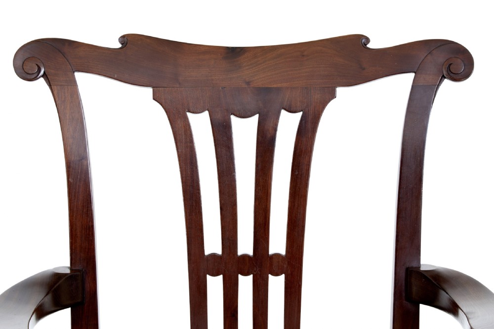 A pair of 19th-century Chippendale style mahogany armchairs featuring pierced back splats, curved armrests, yellow upholstered drop-in seats, and carved cabriole legs. View III