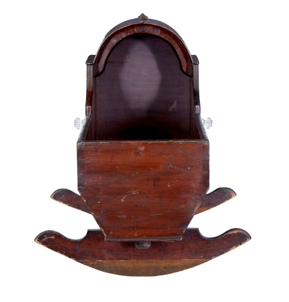 A Victorian pine rocking cradle featuring a curved canopy hood, a dark reddish-brown finish, and two solid wood rockers at the base. View II