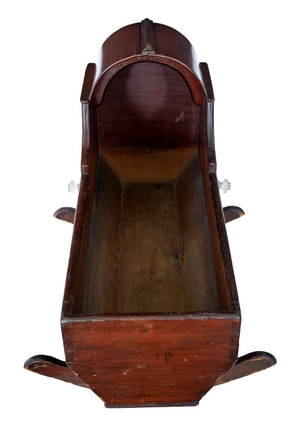 A Victorian pine rocking cradle featuring a curved canopy hood, a dark reddish-brown finish, and two solid wood rockers at the base. View V