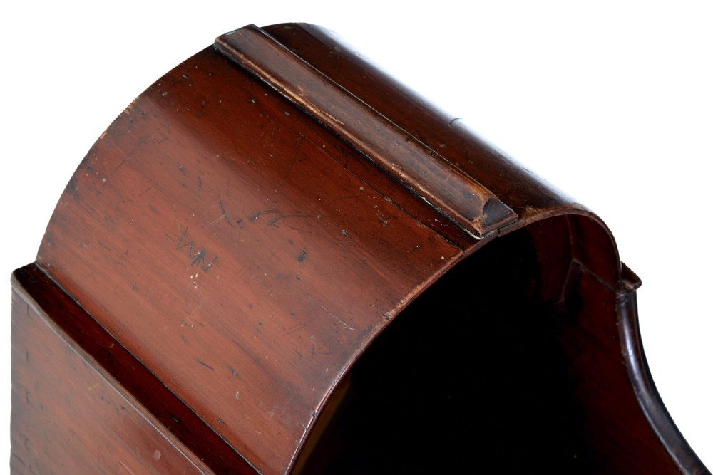 A Victorian pine rocking cradle featuring a curved canopy hood, a dark reddish-brown finish, and two solid wood rockers at the base. View VII