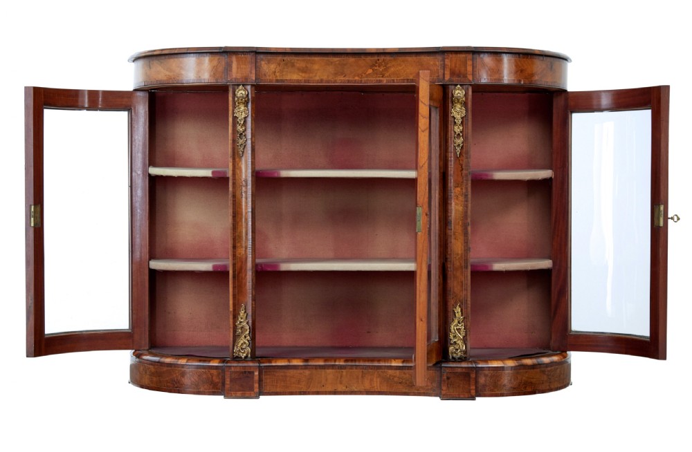A 19th-century Victorian burr walnut glazed credenza featuring curved glass side doors and decorative gilt metal mounts. View II