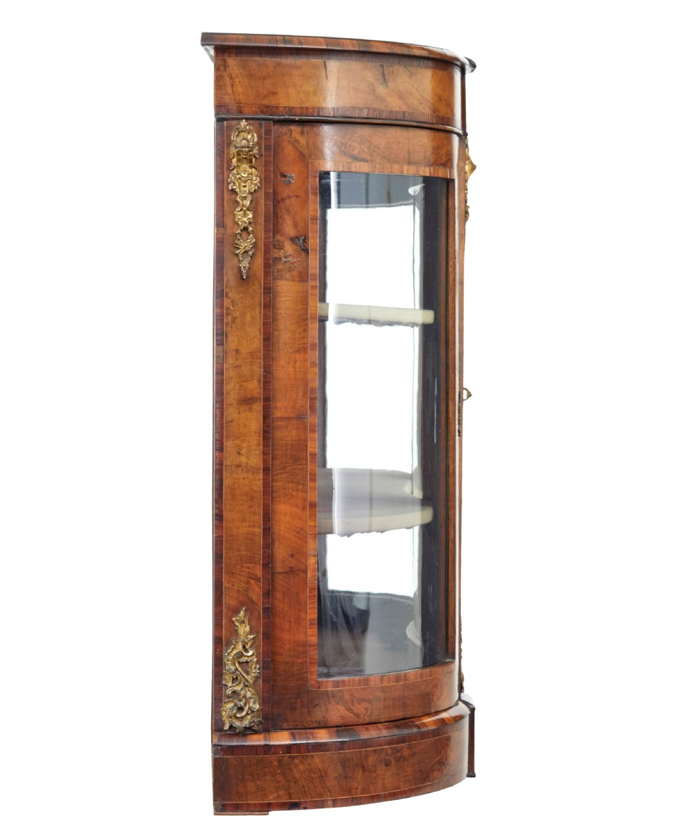 A 19th-century Victorian burr walnut glazed credenza featuring curved glass side doors and decorative gilt metal mounts. View III