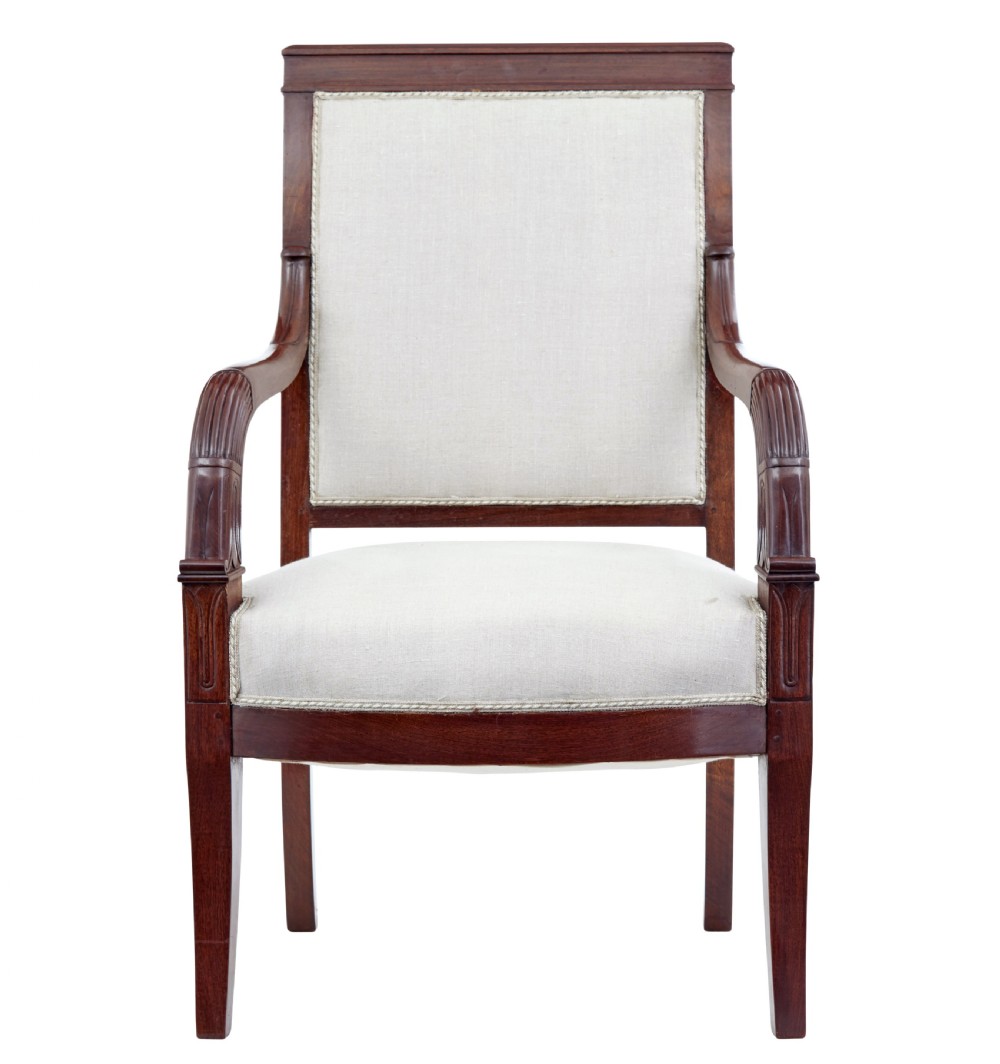 A seven-piece nineteenth-century French Empire mahogany salon suite upholstered in off-white fabric with carved reeded armrests. View VIII