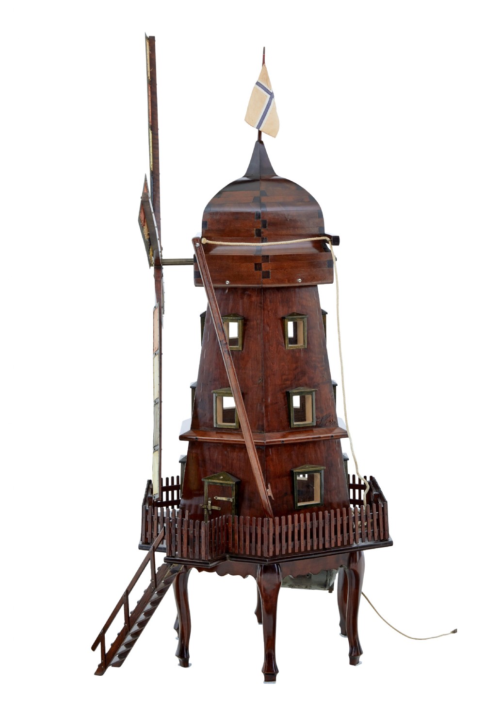 An early twentieth-century wooden scale model of a Dutch windmill, featuring multi-pane sails, brass fittings, a railed balcony, and a wooden ladder. View III