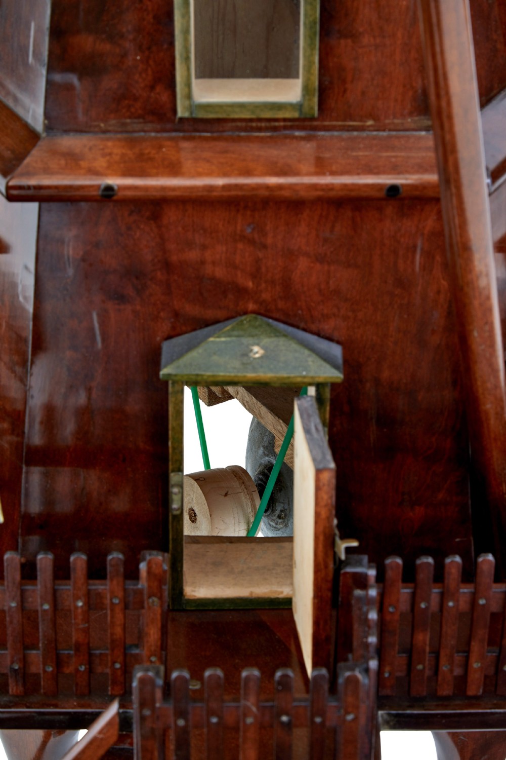 An early twentieth-century wooden scale model of a Dutch windmill, featuring multi-pane sails, brass fittings, a railed balcony, and a wooden ladder. View IX