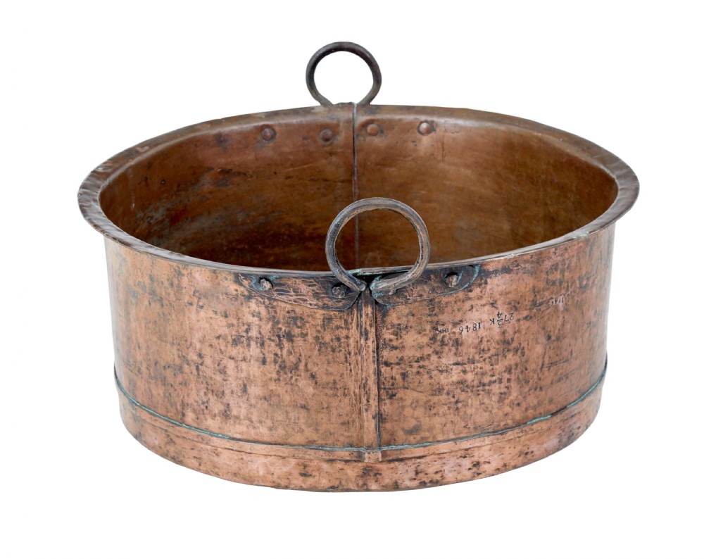 A large round 19th-century hand-hammered copper cooking vessel featuring dual vertical loop handles attached with rivets. View III