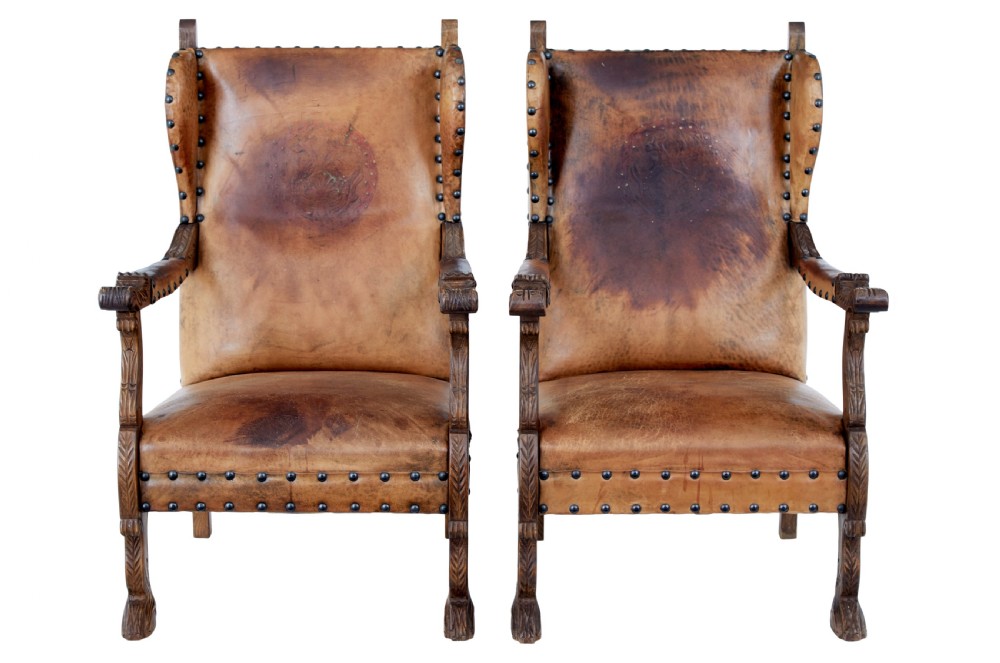 PAIR OF 19TH CENTURY CARVED OAK AND LEATHER ARMCHAIRS