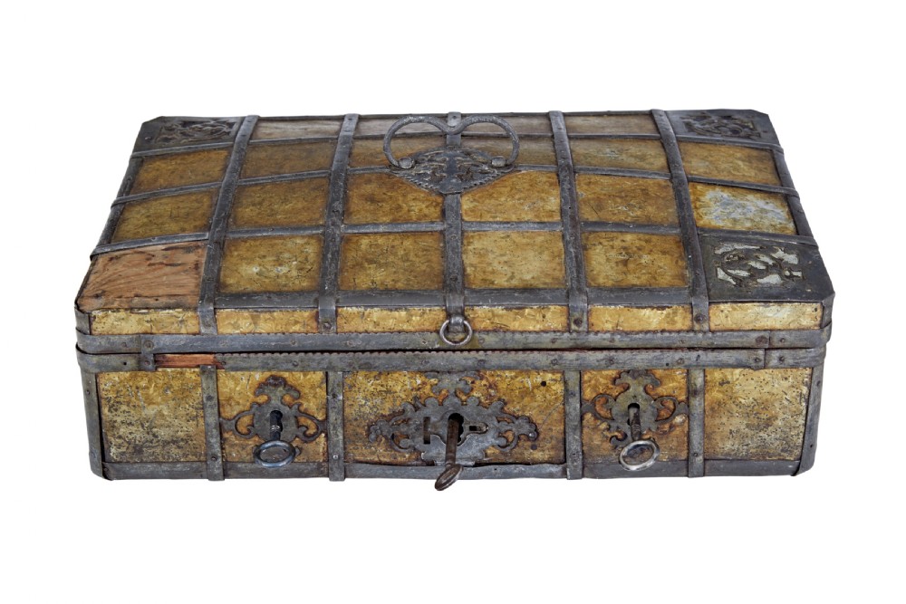 An eighteenth-century Scandinavian metal-bound box featuring an ochre patterned surface, wrought-iron strapping, double keyhole escutcheons with keys, and a top carrying handle. View II