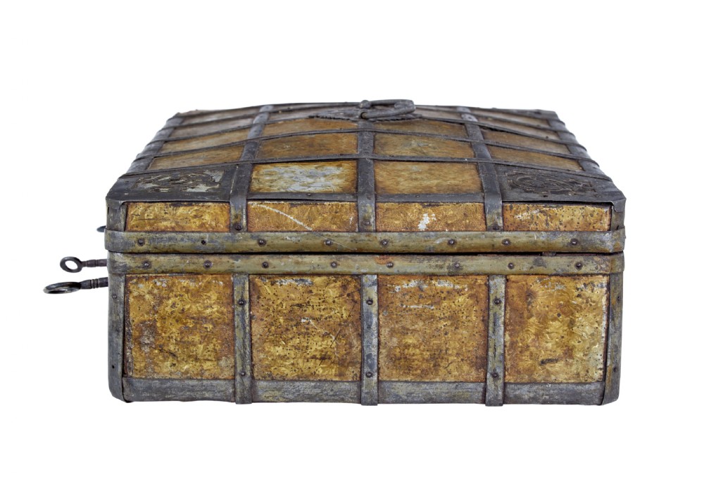 An eighteenth-century Scandinavian metal-bound box featuring an ochre patterned surface, wrought-iron strapping, double keyhole escutcheons with keys, and a top carrying handle. View III