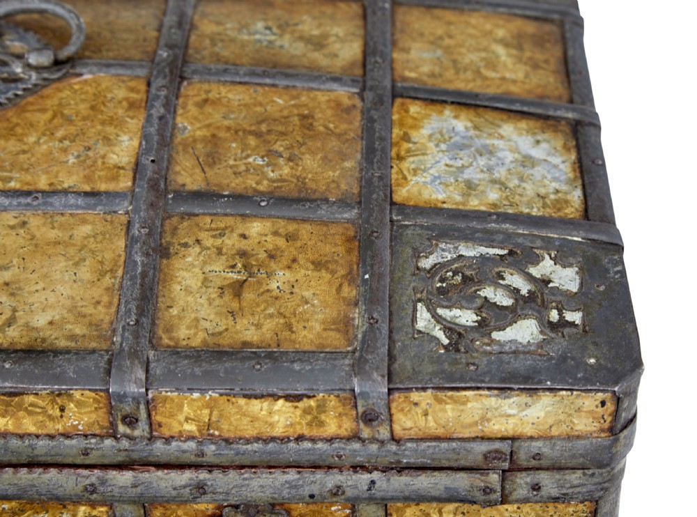 An eighteenth-century Scandinavian metal-bound box featuring an ochre patterned surface, wrought-iron strapping, double keyhole escutcheons with keys, and a top carrying handle. View VII