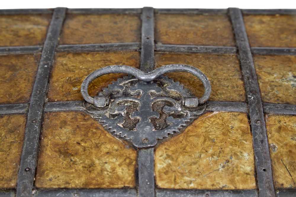 An eighteenth-century Scandinavian metal-bound box featuring an ochre patterned surface, wrought-iron strapping, double keyhole escutcheons with keys, and a top carrying handle. View VIII