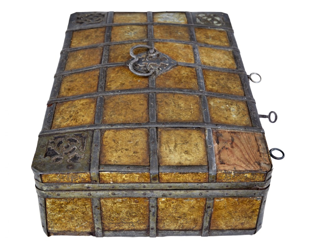 An eighteenth-century Scandinavian metal-bound box featuring an ochre patterned surface, wrought-iron strapping, double keyhole escutcheons with keys, and a top carrying handle. View IX