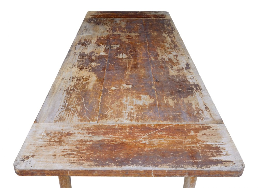 A long 19th-century Burmese teak table with a weathered brown finish and white hand-painted Burmese script across the front frieze. View VI