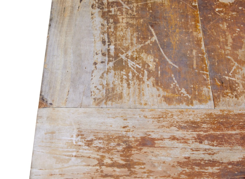 A long 19th-century Burmese teak table with a weathered brown finish and white hand-painted Burmese script across the front frieze. View VII