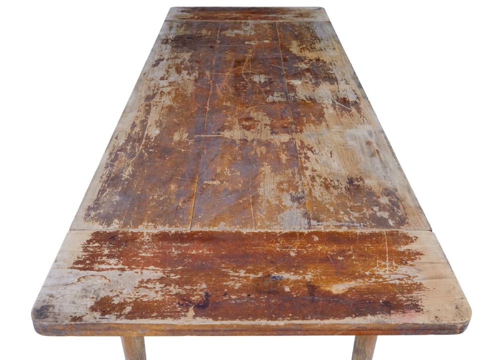 A long 19th-century Burmese teak table with a weathered brown finish and white hand-painted Burmese script across the front frieze. View VIII