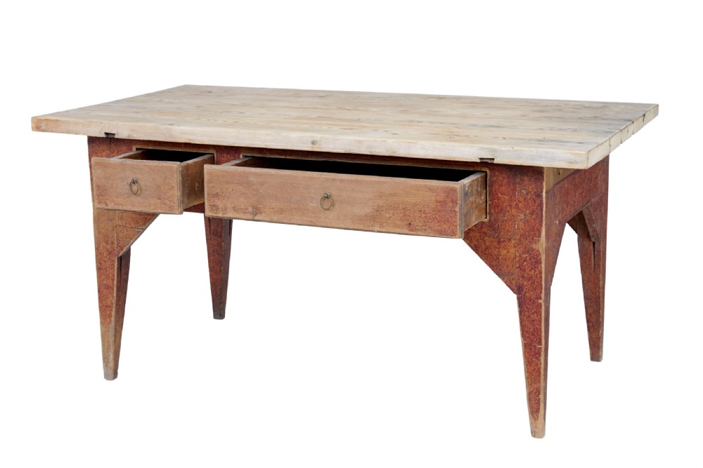 A mid 19th-century rustic pine kitchen table featuring a light wood top, a painted reddish-brown apron, and four tapered square legs. View V