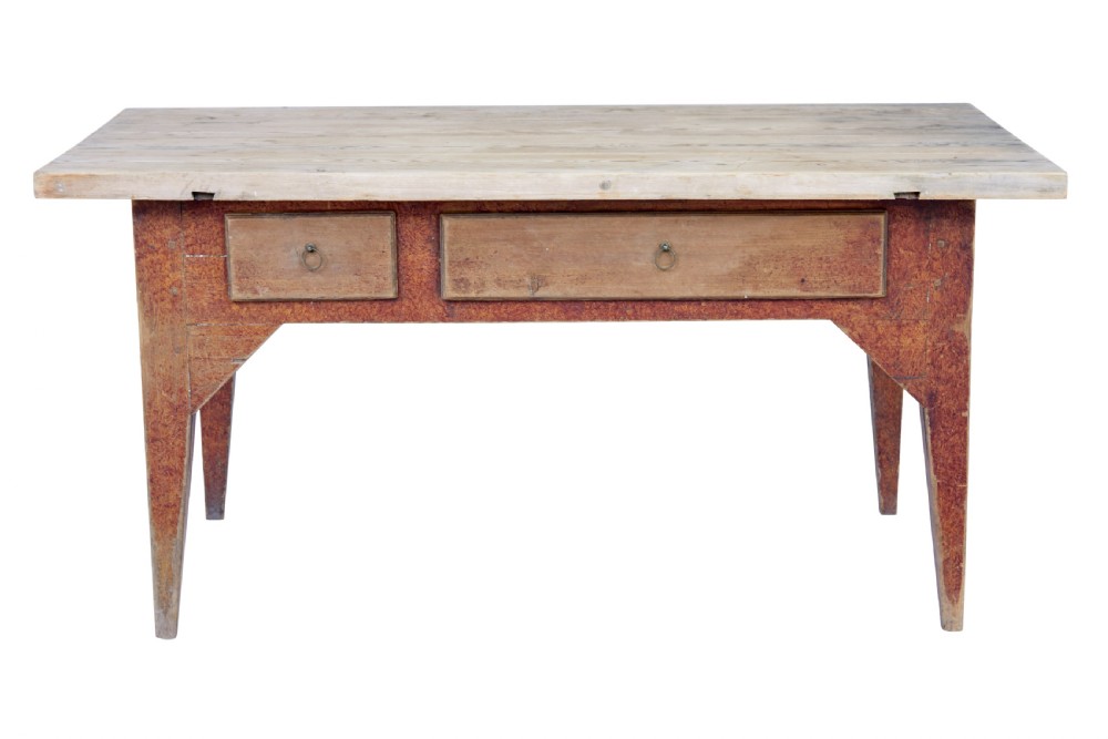A mid 19th-century rustic pine kitchen table featuring a light wood top, a painted reddish-brown apron, and four tapered square legs. View VI