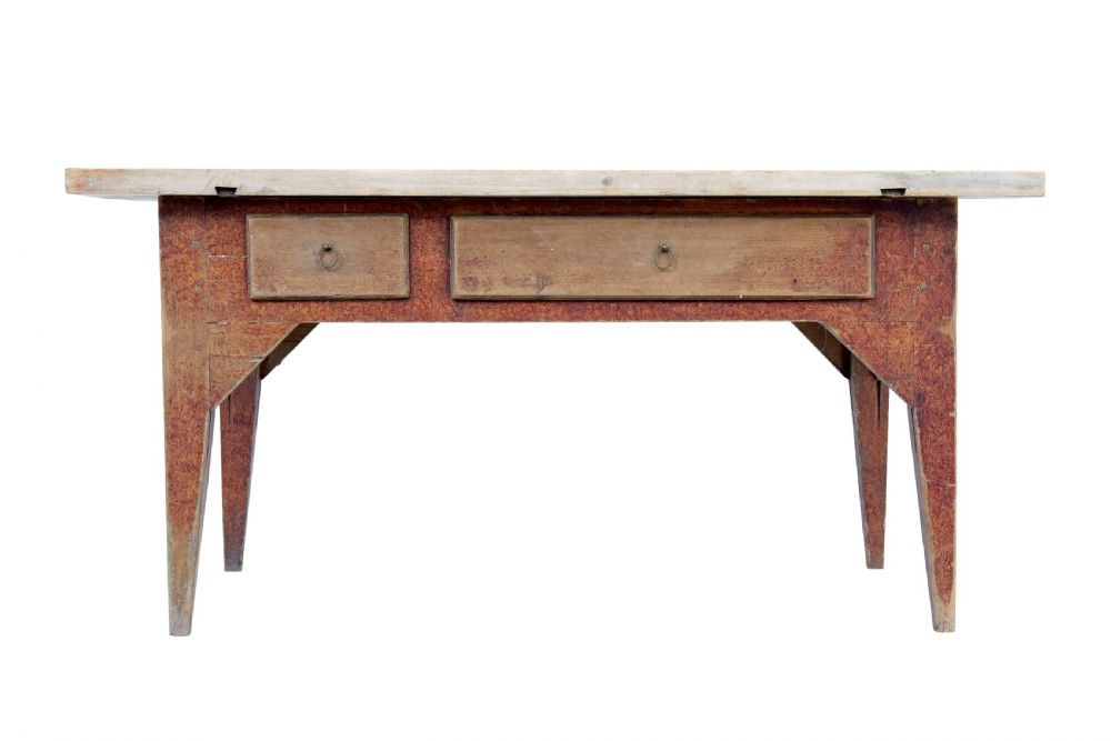 A mid 19th-century rustic pine kitchen table featuring a light wood top, a painted reddish-brown apron, and four tapered square legs. View VII