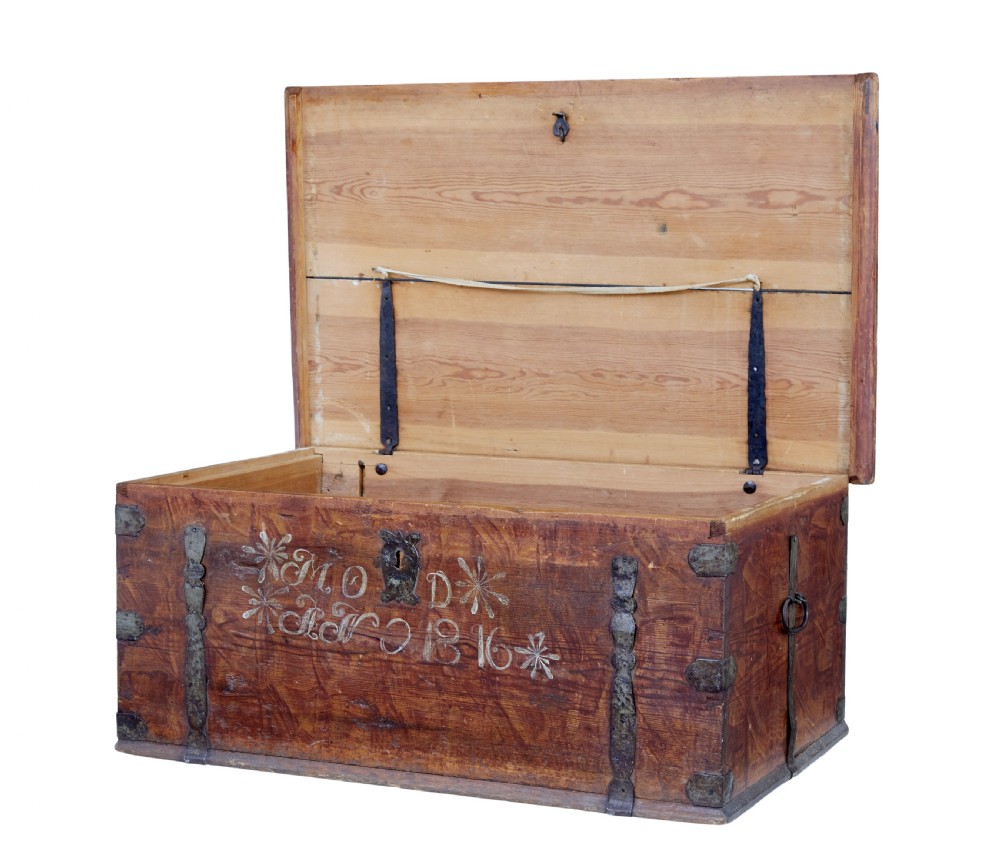 An early 19th-century Swedish pine blanket box featuring white hand-painted initials, the date 1816, star motifs, and hand-forged iron fittings. View II