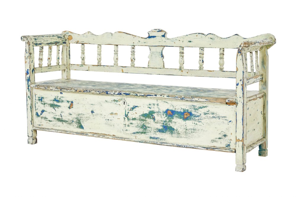 A 19th-century Swedish painted pine storage bench with distressed off-white and blue paint, spindle backrest, and box seat base.