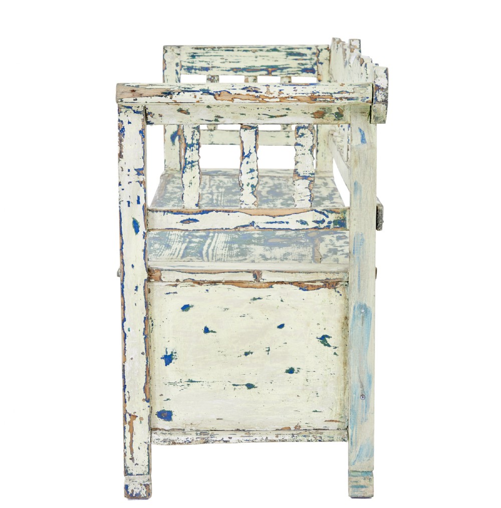 A 19th-century Swedish painted pine storage bench with distressed off-white and blue paint, spindle backrest, and box seat base. View IV