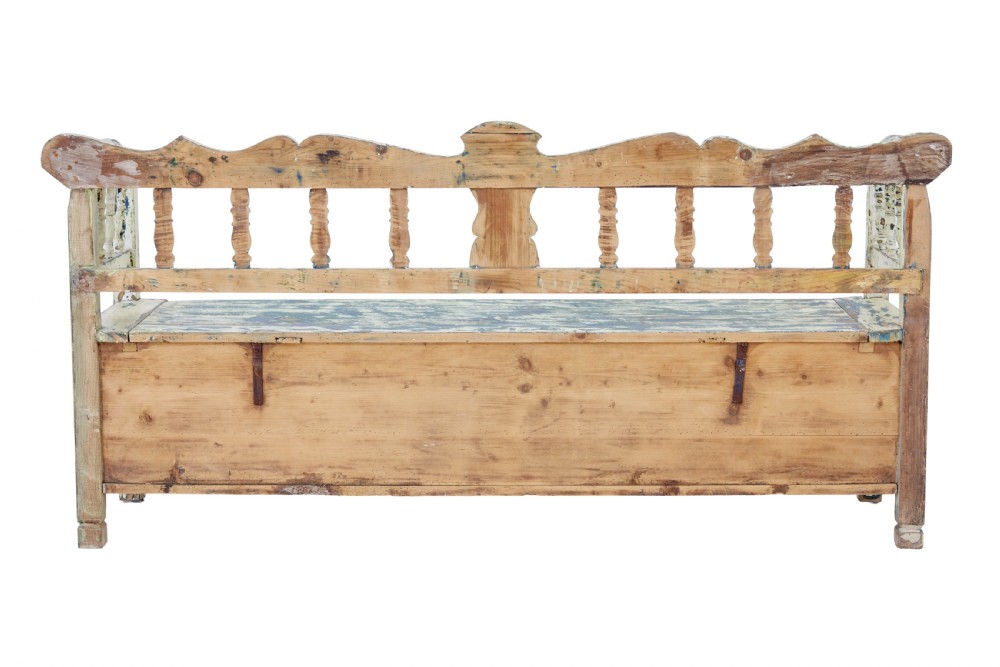 A 19th-century Swedish painted pine storage bench with distressed off-white and blue paint, spindle backrest, and box seat base. View VI
