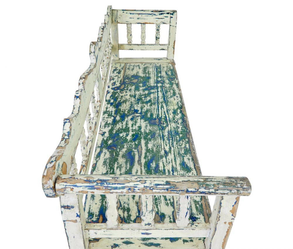 A 19th-century Swedish painted pine storage bench with distressed off-white and blue paint, spindle backrest, and box seat base. View VII