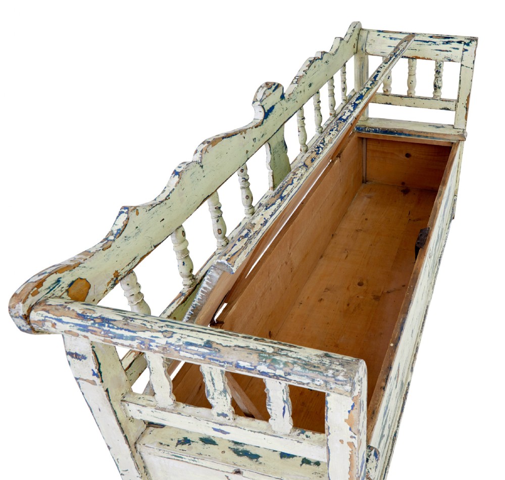 A 19th-century Swedish painted pine storage bench with distressed off-white and blue paint, spindle backrest, and box seat base. View VIII