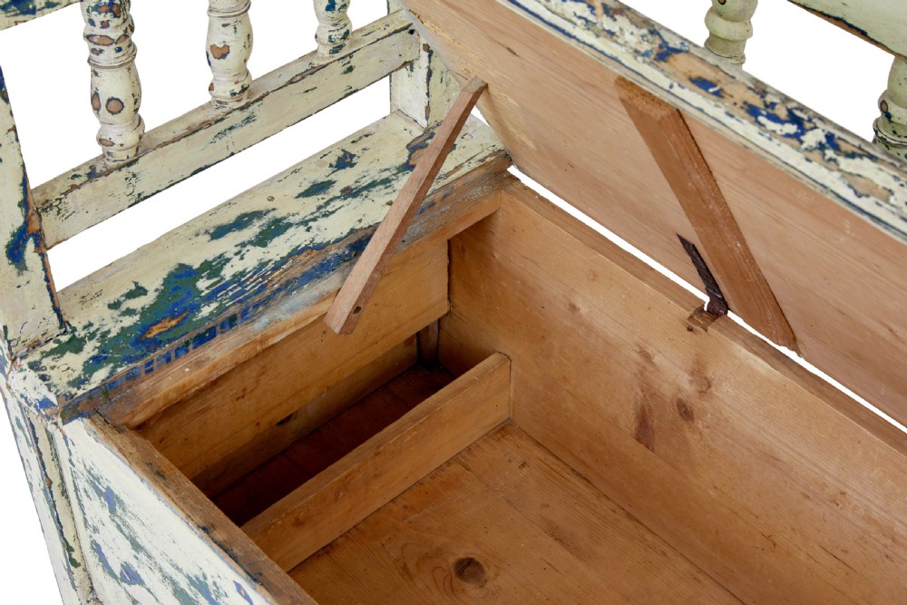 A 19th-century Swedish painted pine storage bench with distressed off-white and blue paint, spindle backrest, and box seat base. View IX