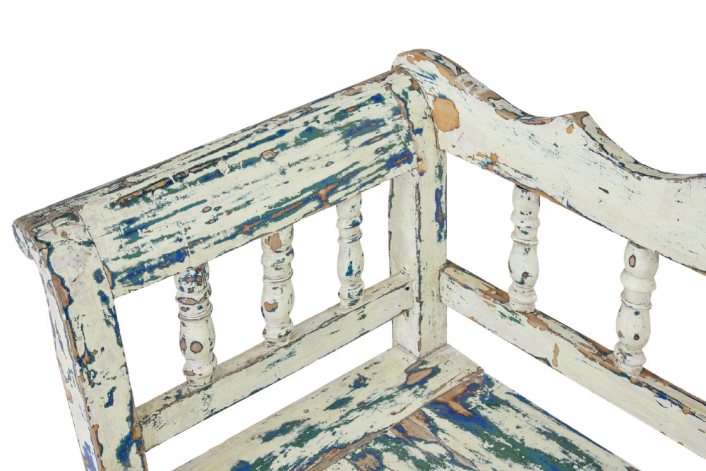 A 19th-century Swedish painted pine storage bench with distressed off-white and blue paint, spindle backrest, and box seat base. View X