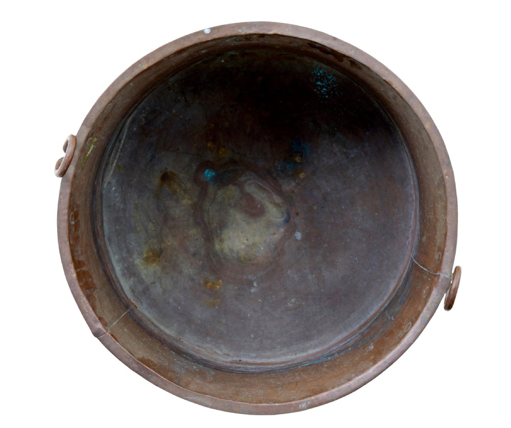 A large 19th-century cylindrical copper cooking pot featuring rolled rims, riveted side handles, and surface verdigris patina. View VI