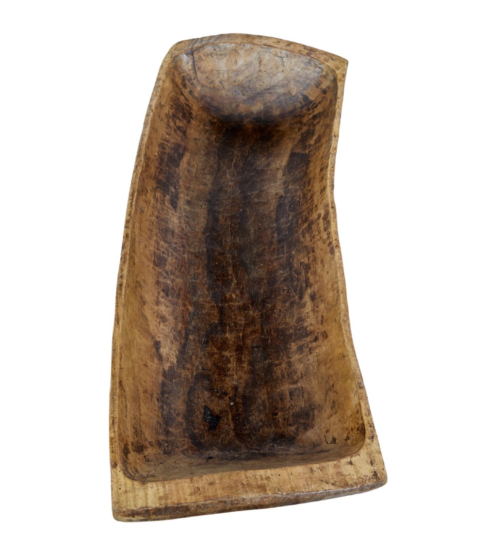 A long hand-carved wooden dugout trough featuring a weathered natural surface finish and chiselled interior. View III