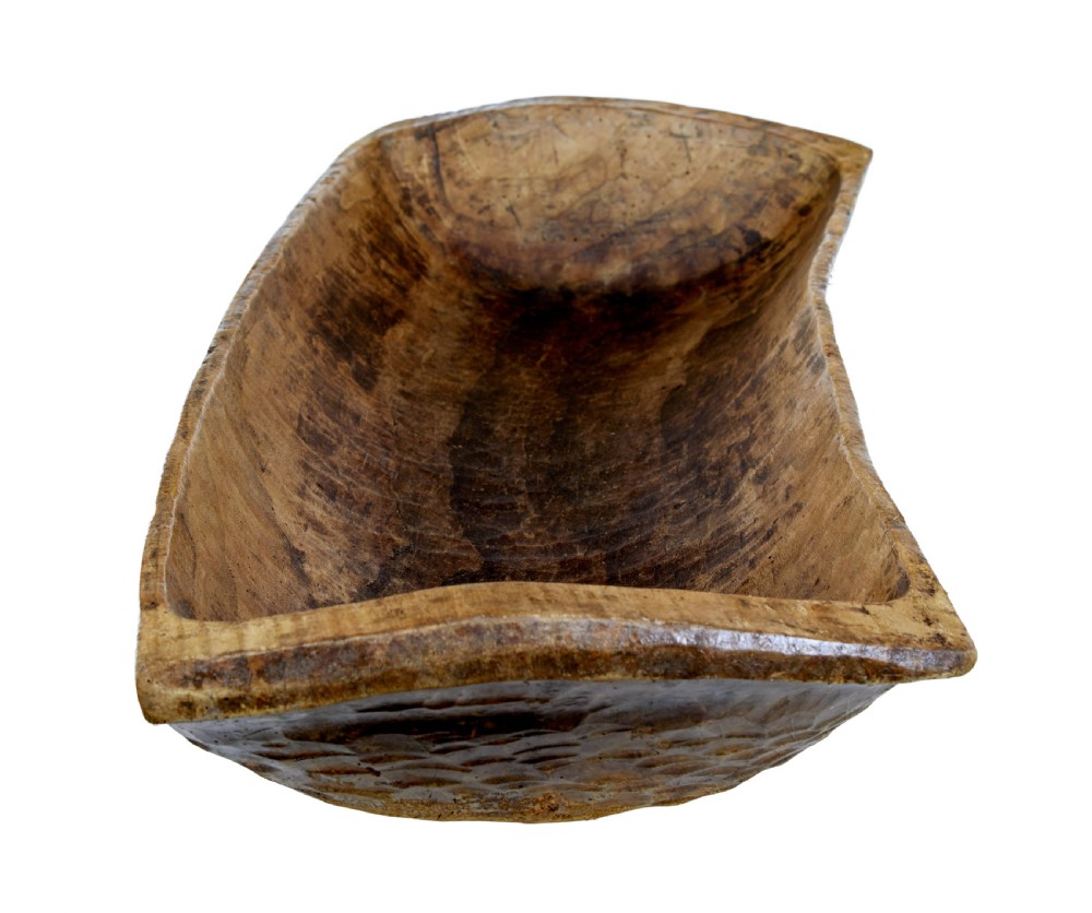 A long hand-carved wooden dugout trough featuring a weathered natural surface finish and chiselled interior. View V