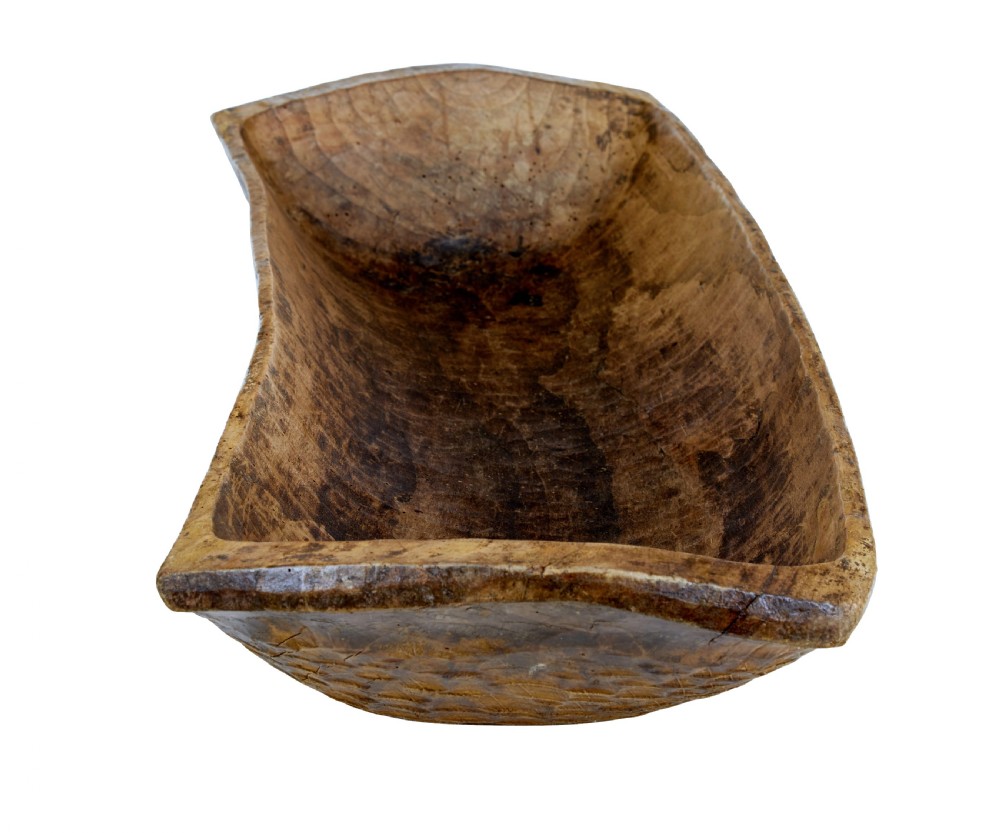A long hand-carved wooden dugout trough featuring a weathered natural surface finish and chiselled interior. View VI