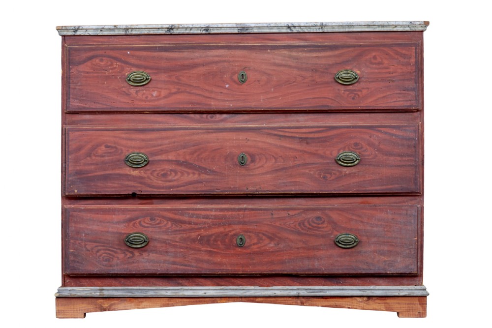 A nineteenth-century Swedish three-drawer chest featuring a reddish-brown faux-grain painted finish and oval brass handles.