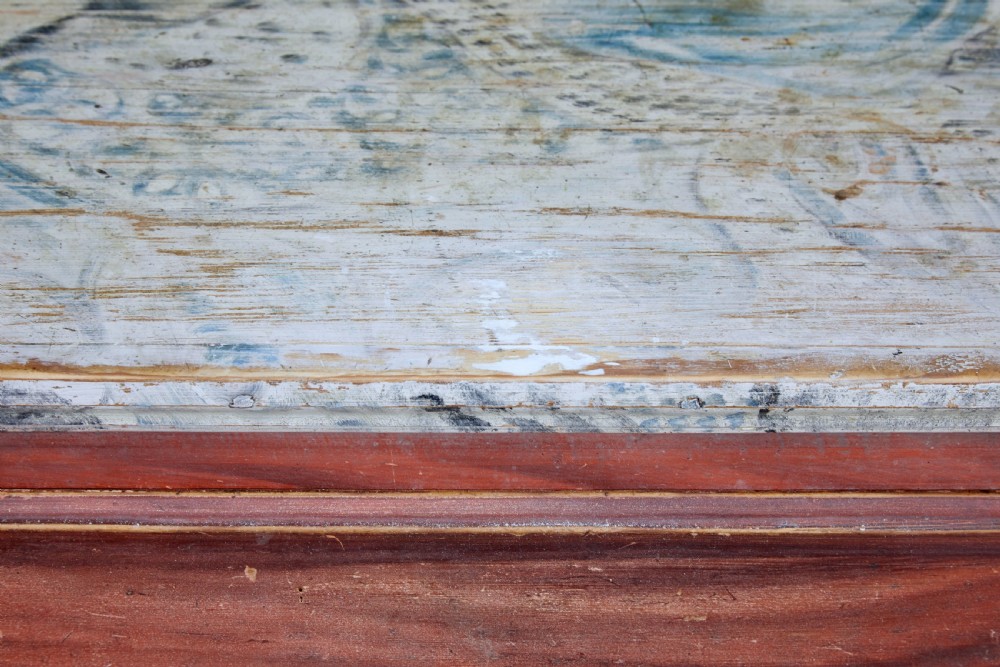 A nineteenth-century Swedish three-drawer chest featuring a reddish-brown faux-grain painted finish and oval brass handles. View V