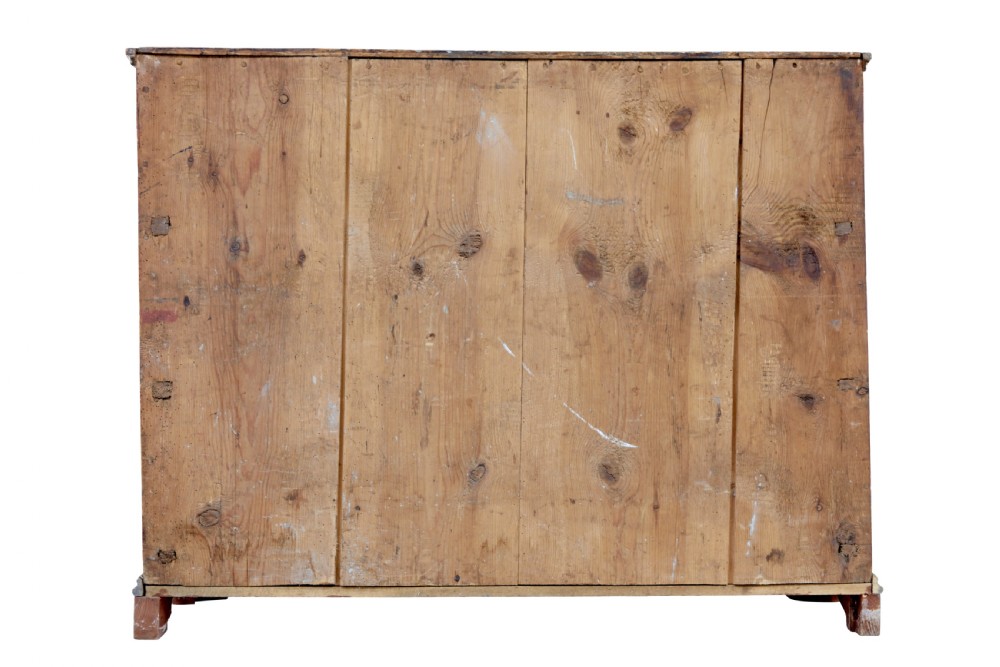 A nineteenth-century Swedish three-drawer chest featuring a reddish-brown faux-grain painted finish and oval brass handles. View X