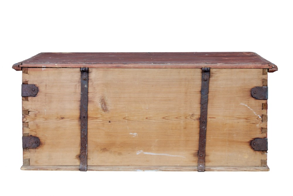 A 19th-century red-painted pine blanket box featuring white hand-painted script dated 1828 and wrought iron corner brackets. View V